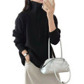 Loose long sleeved sweater with slit hem
